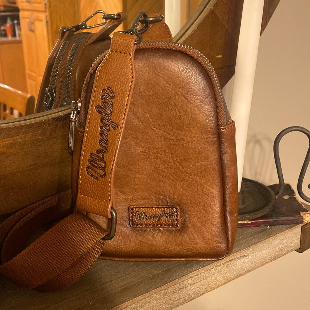 Wrangler. Fake Leather Sling bag. No tags. Only been used once.